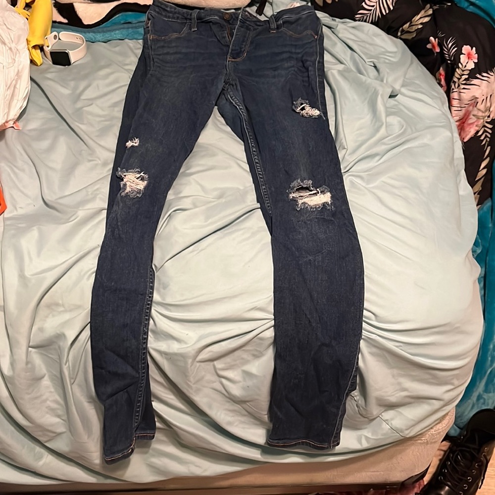 Blue denim jeans with holes